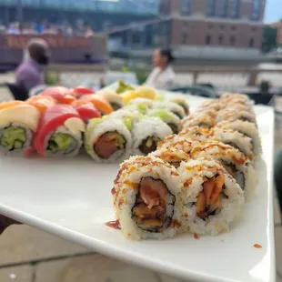a plate of sushi rolls