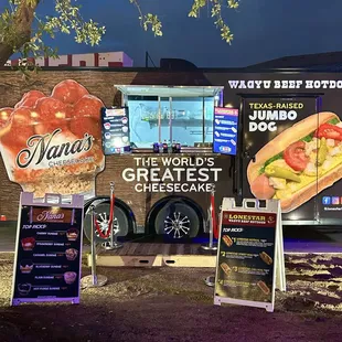 a food truck with a sign for the world&apos;s greatest cheesecake