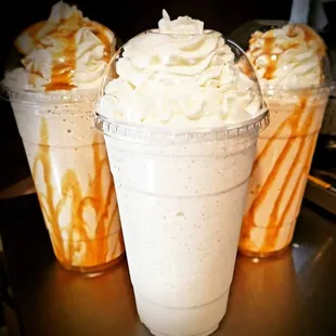 three cups of ice cream and caramel