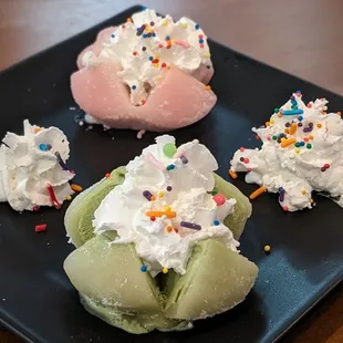 Mochi ice cream for dessert! Green tea and strawberry with whipped cream