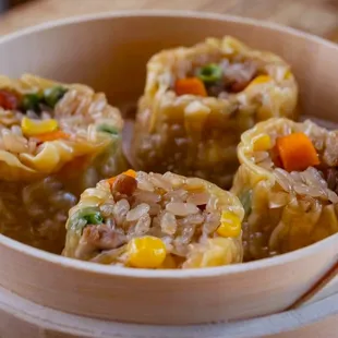 three dumplings in a steamer