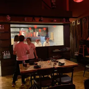 Window showing employees making the dumplings