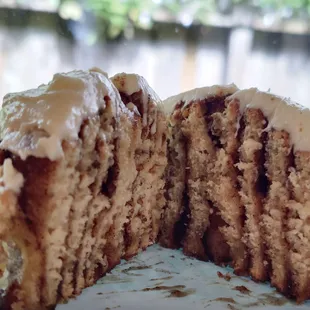 Cross section of the cinnamon roll. You can get light, medium, or gag me level frosting (Nana&apos;s words). This is medium frosting.