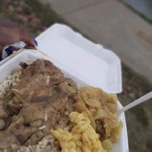 a person holding a container of food