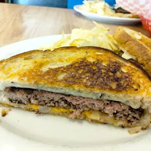 a grilled cheese sandwich and potato chips