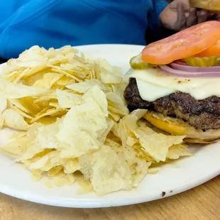 a hamburger and chips on a plate