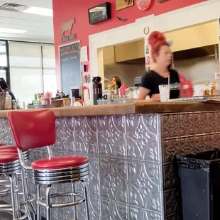 a woman sitting at the counter