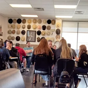 a group of people sitting at tables