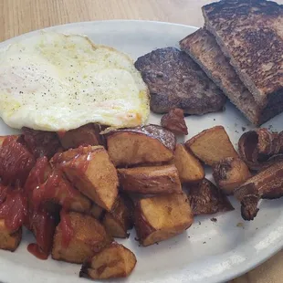 2 eggs over medium w/sausage patty and bacon, wheat toast, potatoes and Coffee!