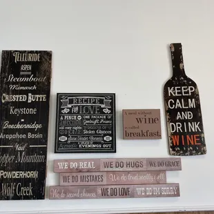 a variety of signs on a wall