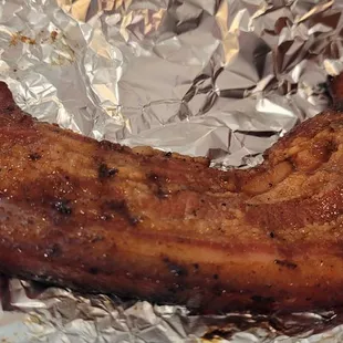 Grilled pork belly that tastes like pork barbecue, best consumed with spiced vinegar dipping sauce.