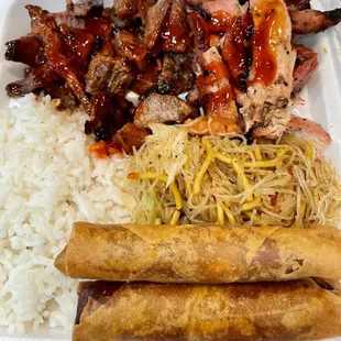 BBQ pork and bbq chicken plate with steamed rice and pancit.  Added a side of lumpia