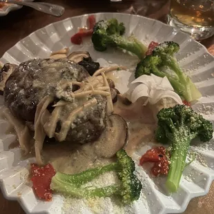 Fillet with wild mushrooms and a Gorgonzola topping served with vegetables.