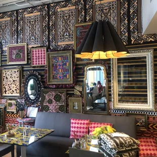 a dining area with a table and chairs