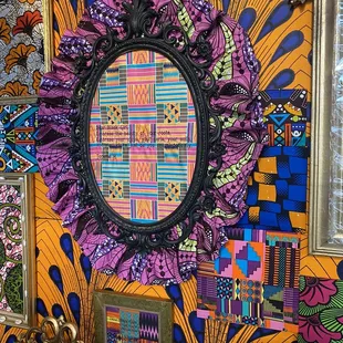 a mirror and a colorful wall