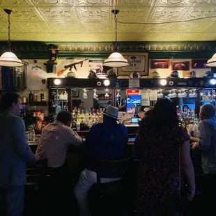 a group of people sitting at a bar