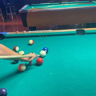 a person playing pool