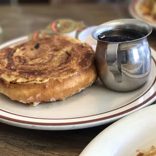 a plate of food and a cup of coffee