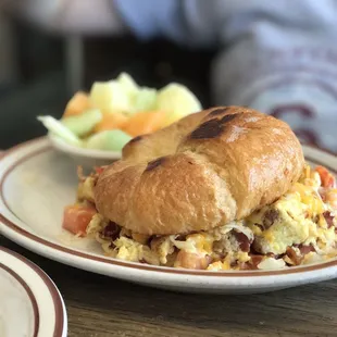 a croissant sandwich on a plate