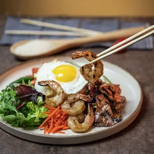 Grilled pork, shrimp, and fried egg broken rice plate