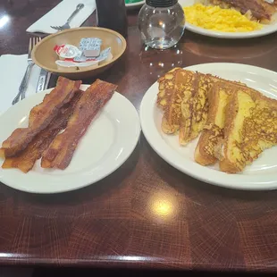 two plates of breakfast food