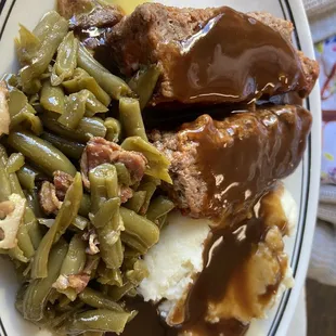 meatloaf dinner with mashed potatoes, green beans and gravy