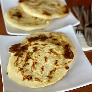 two flatbreads on a plate