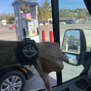 a man&apos;s hand with a watch on his wrist