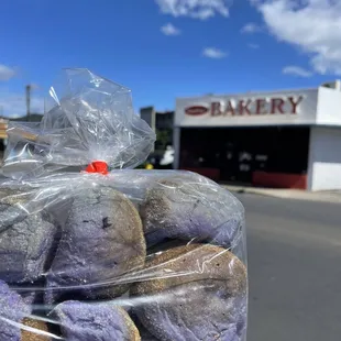 a bag of cookies in front of a bakery