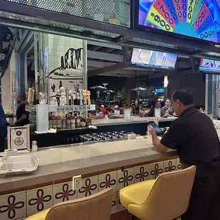 Bar, seating, indoors, and outdoors