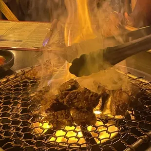 Server cooking the meat