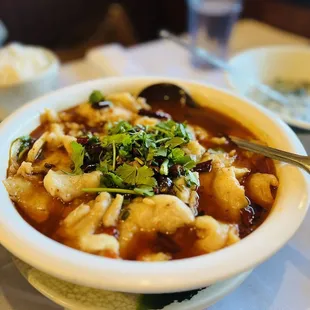 a bowl of soup with a spoon