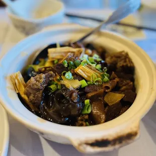 a bowl of stew and a plate of rice
