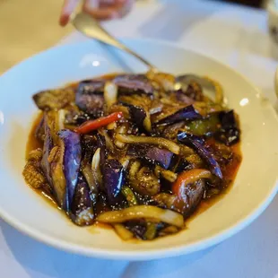 a bowl of stir fried eggplant