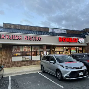 cars parked in front of a restaurant