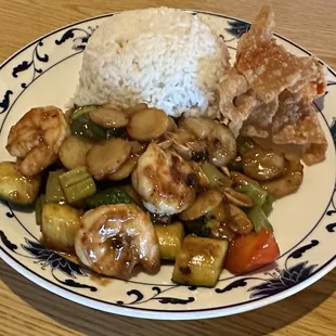 a plate of food with rice and vegetables