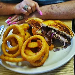 a sandwich and onion rings
