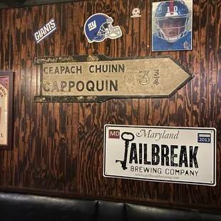 a wooden wall with various signs