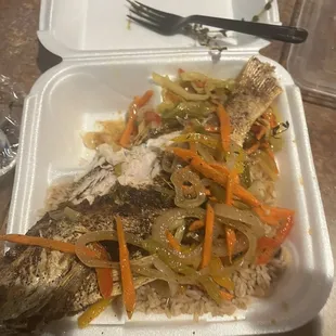 We were hungry and started eating...fried fish, rice, veggies and plantains that i ate already. Fish was delish