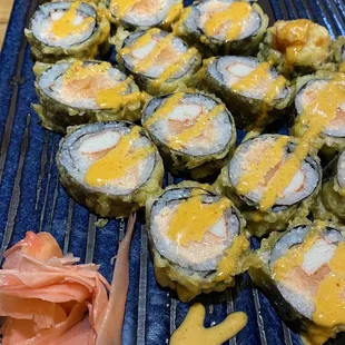 a plate of sushi rolls
