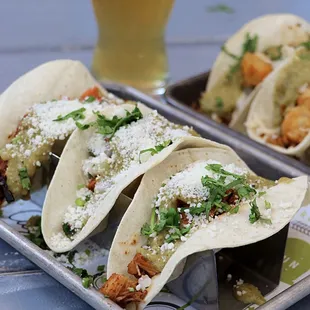 Adobado Pollo taco --Grilled chicken thigh, salsa fresca, salsa verde, cotija, cilantro.