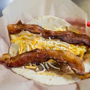 bacon and cheese on a tortilla
