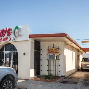 a car parked in front of a restaurant