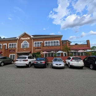 Outside. Storefront view from parking lot. Located in the Pinnacle building at Carolina Pointe I on Farrington Rd at 54.