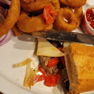 Steak sandwich with onion rings