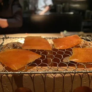 a close up of a cake with orange slices