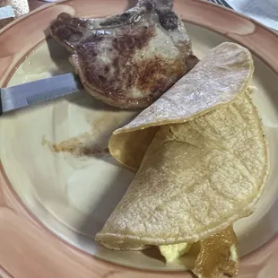 Pork chop &amp; Migas on corn tortilla