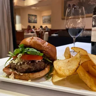 a burger and chips on a plate