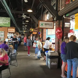 the inside of a restaurant with people eating