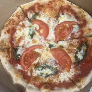 a whole pizza in a box